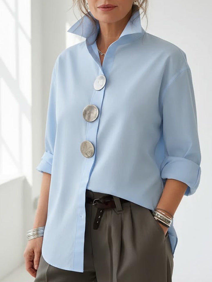Chic women's long sleeve blouse with large decorative buttons. Perfect for versatile everyday wear.