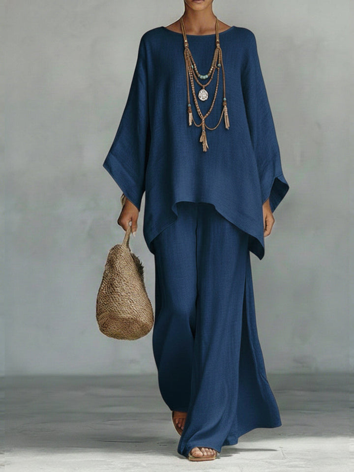 Chic women's linen wide sleeve top & trouser set. Versatile elegant two-piece for summer or casual wear.