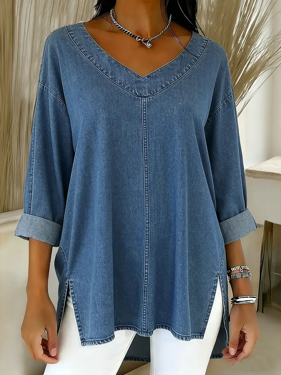 Women's timeless denim shirt with long sleeves & V-neck. Relaxed fit for casual and office casual wear.