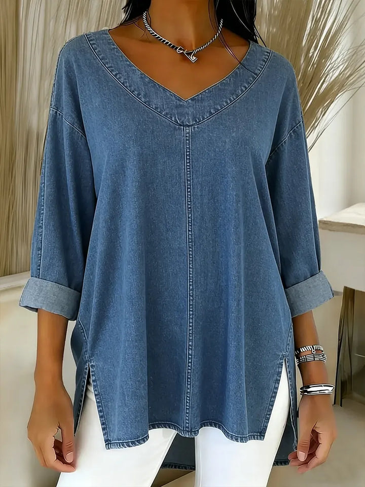 Women's timeless denim shirt with long sleeves & V-neck. Relaxed fit for casual and office casual wear.