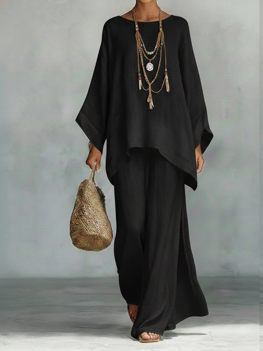 Stylish women's elegant linen wide sleeve top and trouser set. Comfortable two-piece for chic summer fashion.