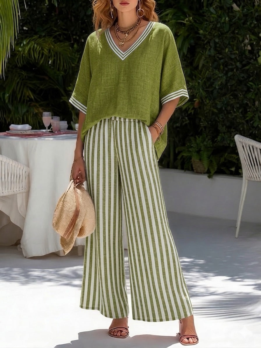 Stylish women's V-neck top and striped wide-leg pant set, a comfortable spring/summer two-piece casual outfit.