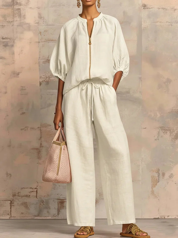 Versatile women's two-piece set: a relaxed shirt and wide-leg trousers. Great for elegant casual or loungewear style.