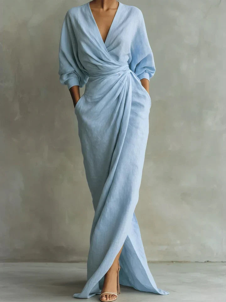 Chic women's V-neck dress with 3/4 sleeves, offering an elegant yet casual loose fit. Great for warm weather.