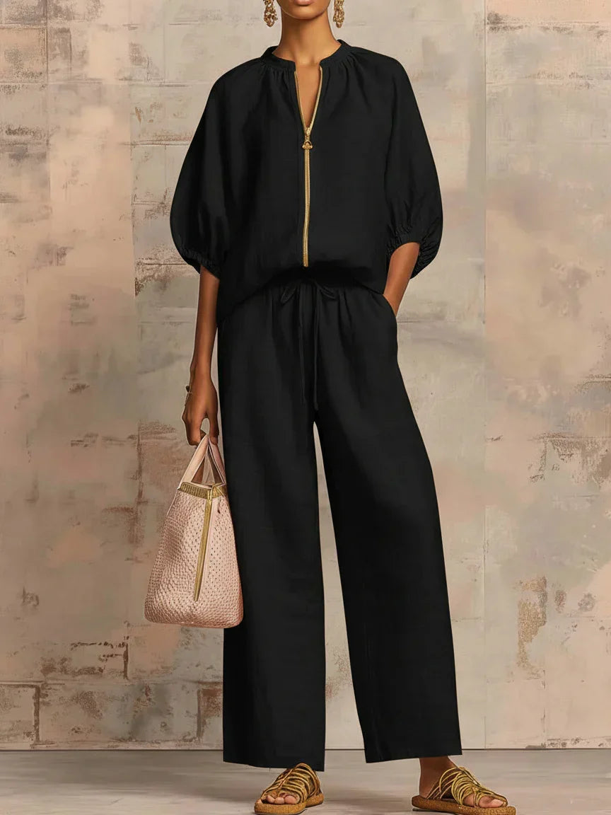 Comfortable women's loungewear set: a relaxed fit button-up shirt and wide-leg trousers. Perfect casual fashion.