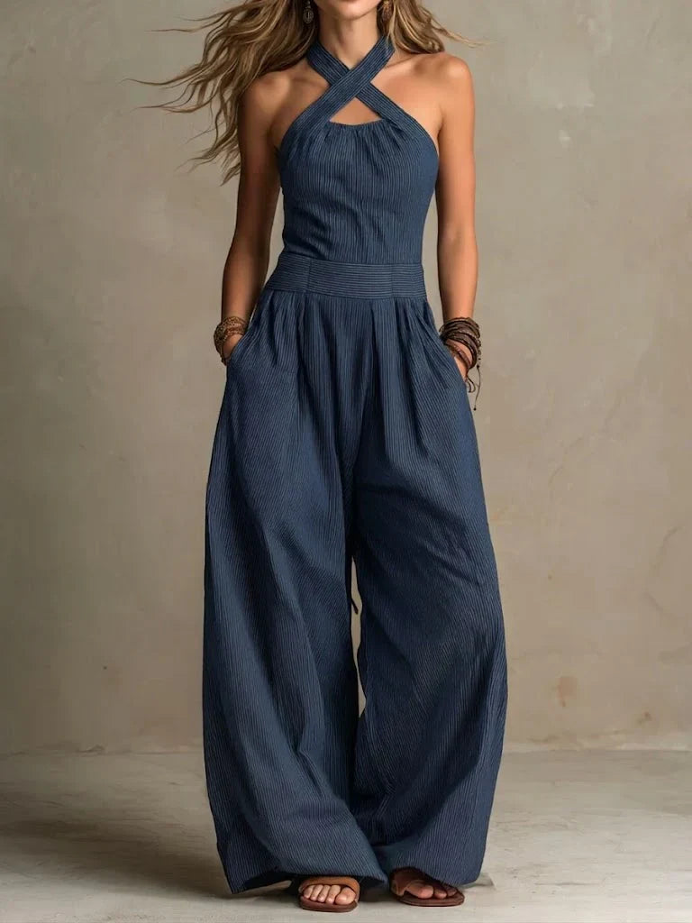Elegant women's wide-leg jumpsuit with a stylish cross neckline, perfect for summer chic and versatile day-to-night fashion.