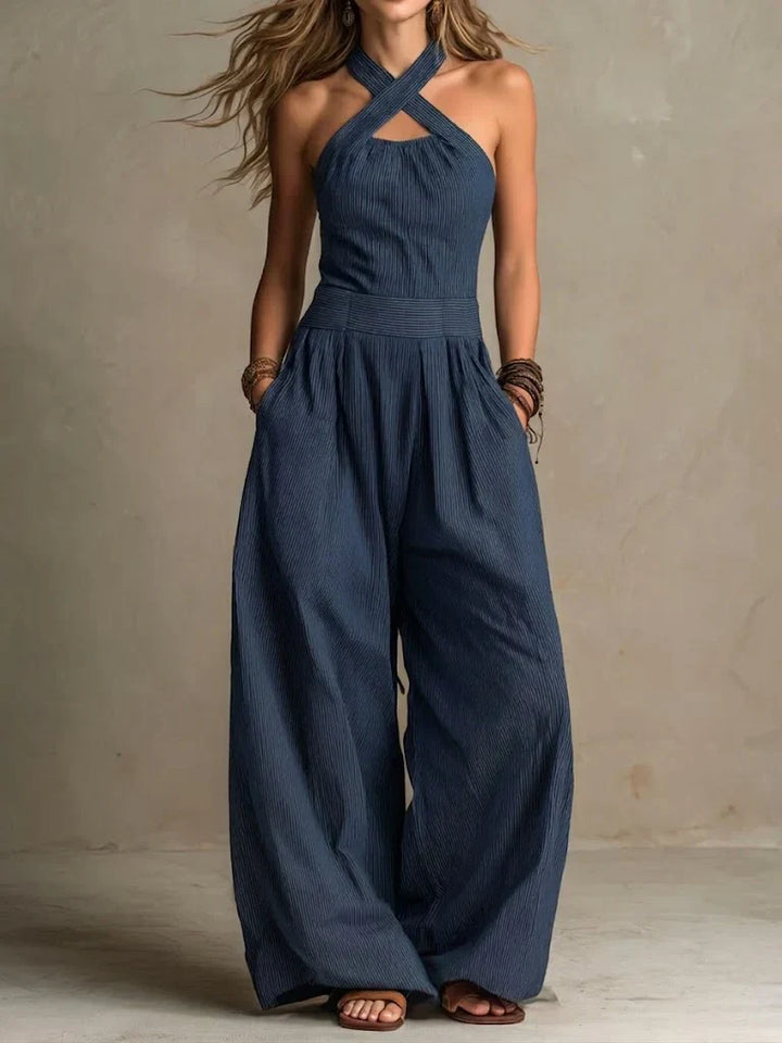 Elegant women's wide-leg jumpsuit with a stylish cross neckline, perfect for summer chic and versatile day-to-night fashion.
