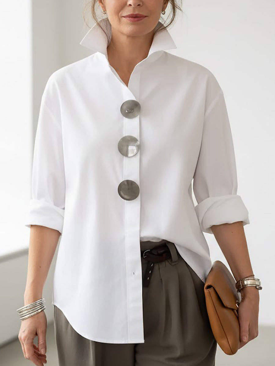 Relaxed fit women's blouse featuring a stylish stand collar and prominent button front closure.