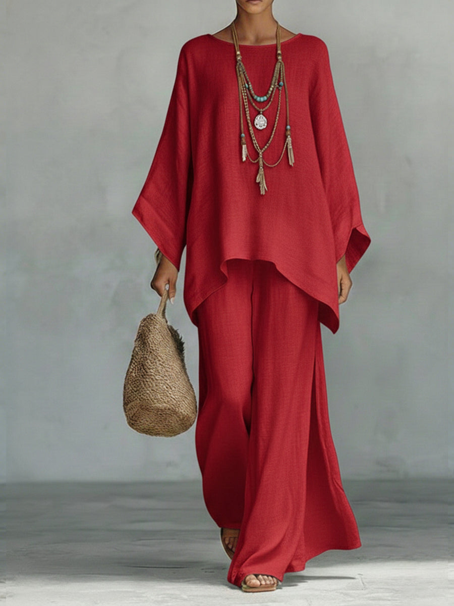 Women's two-piece linen set with wide sleeves & flowing trousers. Ideal elegant outfit for summer comfort.