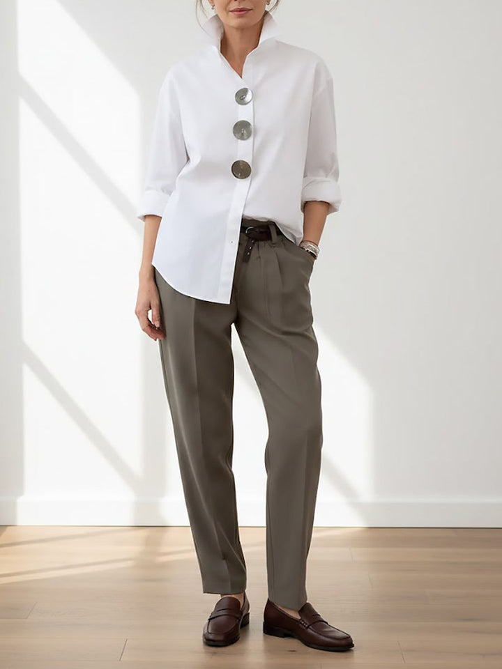 Stylish women's long sleeve blouse, button front design with large buttons and a relaxed, chic silhouette.