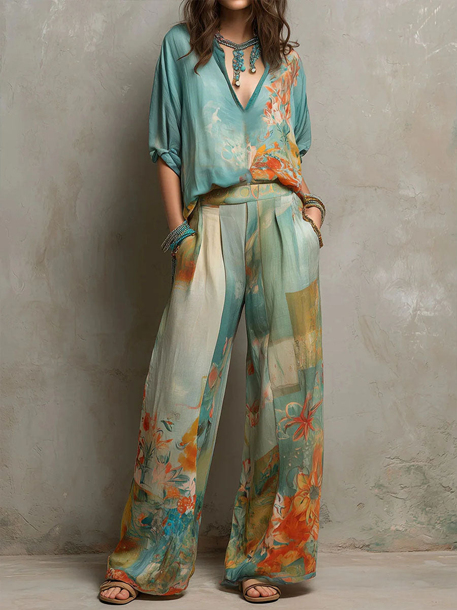 Women's elegant floral two-piece set with wide-leg pants and a V-neck top, perfect for summer resort wear.