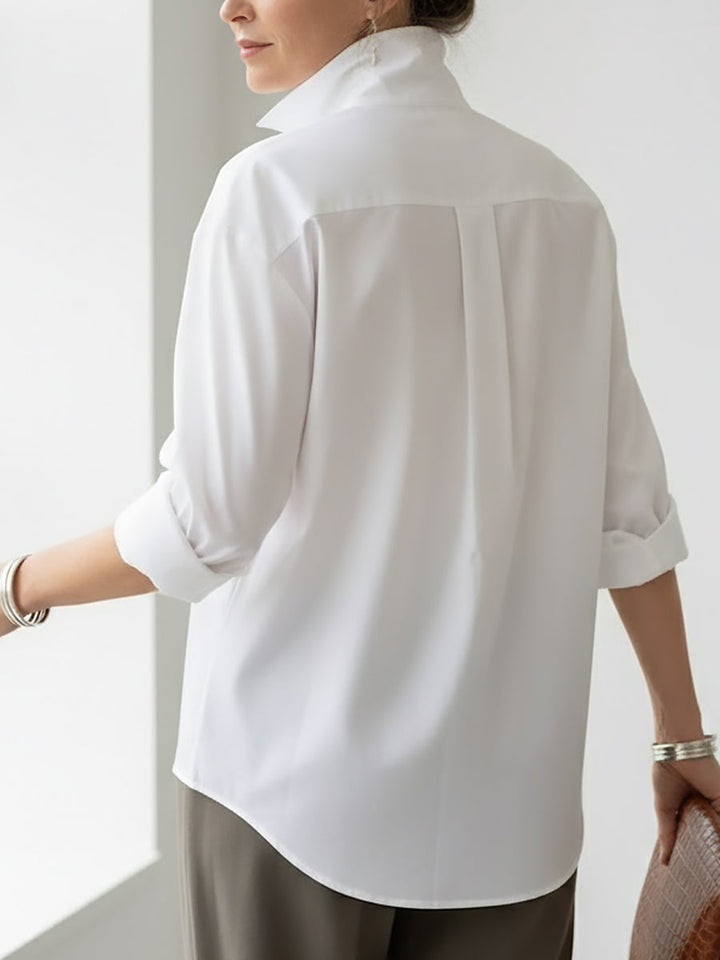 Everyday women's long sleeve blouse featuring large buttons & a sophisticated stand collar for a relaxed fit.