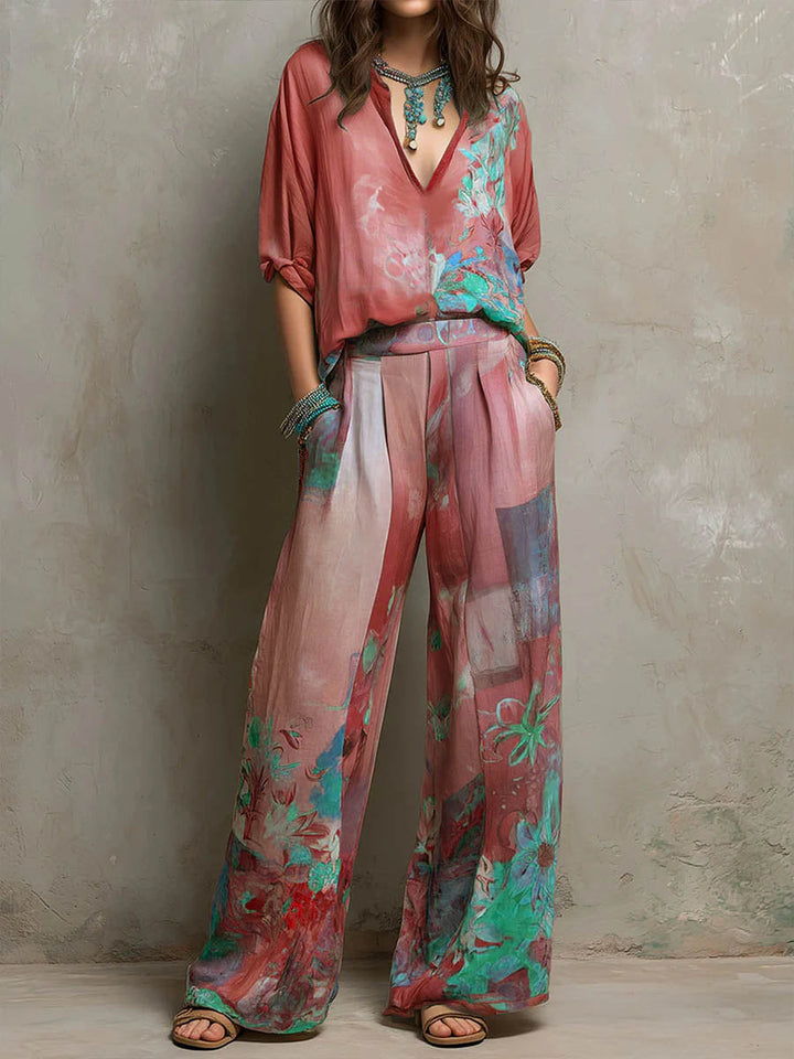 Chic women's floral wide-leg pant set. Features a stylish V-neck top and comfortable flowy wide-leg pants for resort wear.