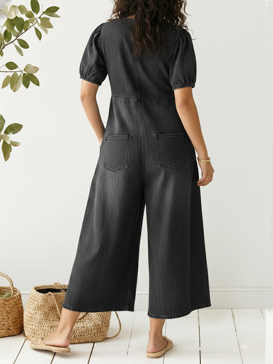 Effortless dark blue women's denim jumpsuit, relaxed fit & sleeveless design for ultimate summer comfort.