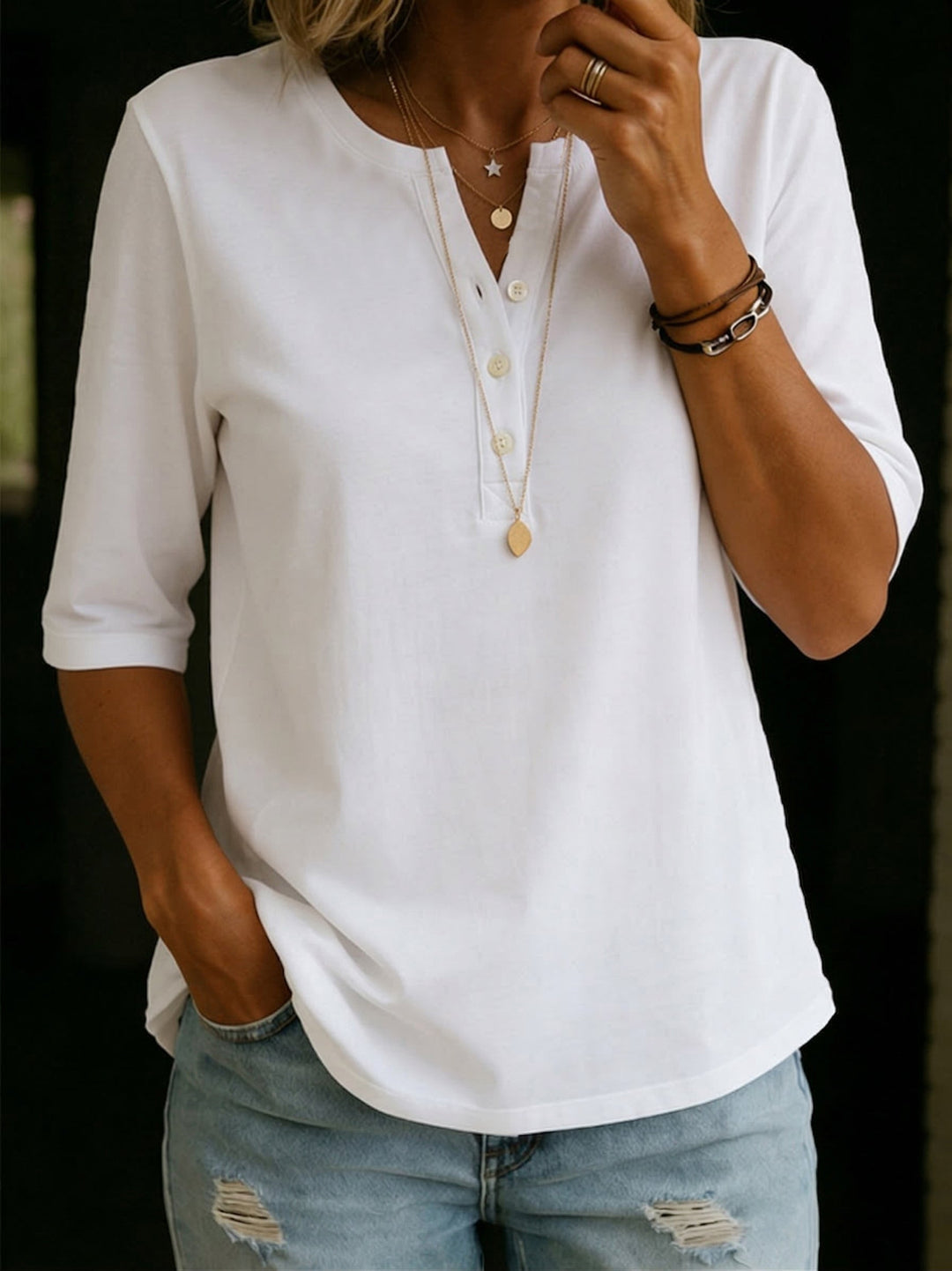 Women's versatile V-neck blouse in a relaxed fit with 3/4 sleeves. Great for smart casual or comfortable daily outfits.