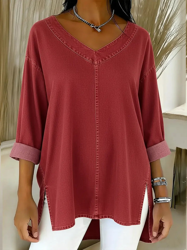 Modern ladies' denim shirt with long sleeves and V-neck. A relaxed fit casual top for stylish comfort.