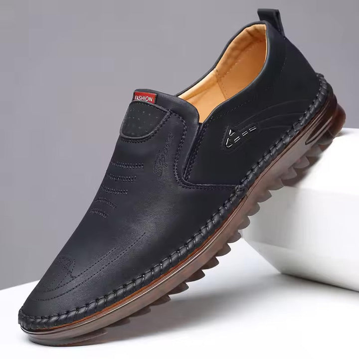 "Orthopedic men's shoes with breathable mesh, air-cushioned sole, stylish black design. Ideal for all-day comfort."