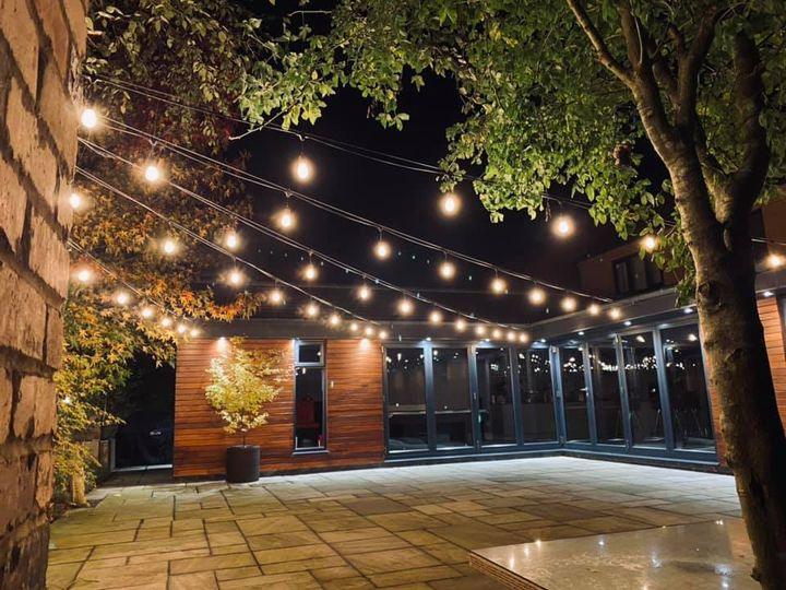 Waterproof connectable LED patio string lights, ideal for illuminating outdoor dining areas & creating ambiance.