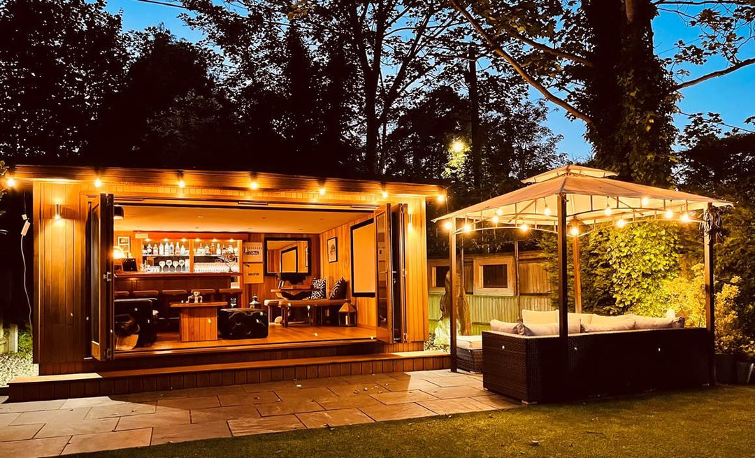 Warm white outdoor LED string lights, creating cozy ambiance for garden parties, decks & cafe settings.