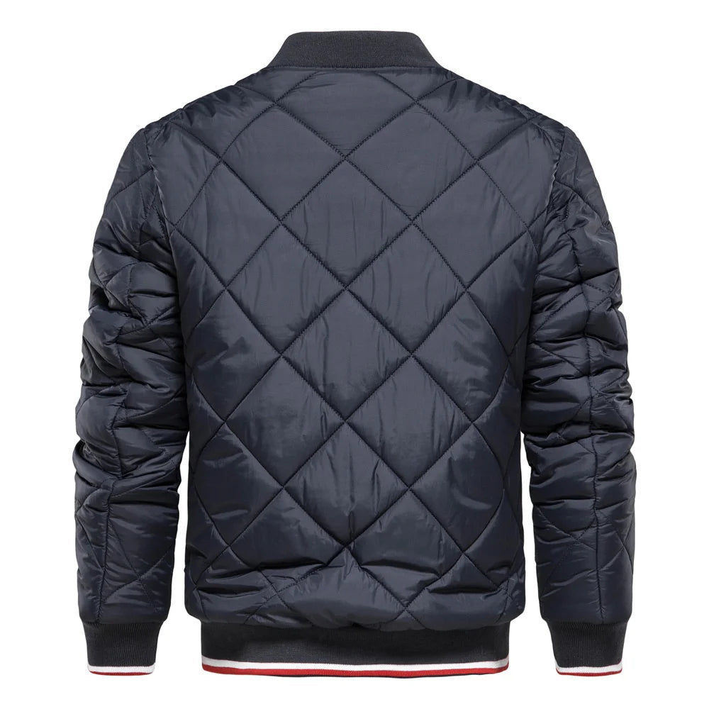 Man wearing a stylish black diamond quilted bomber jacket, ideal men's outerwear for a modern, casual look.