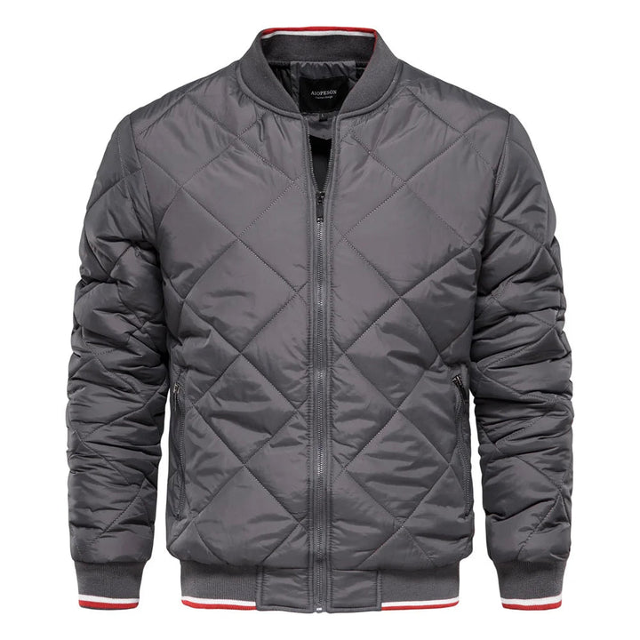 Close-up of men's diamond quilted bomber jacket showcasing detailed stitching and sturdy zip closure.