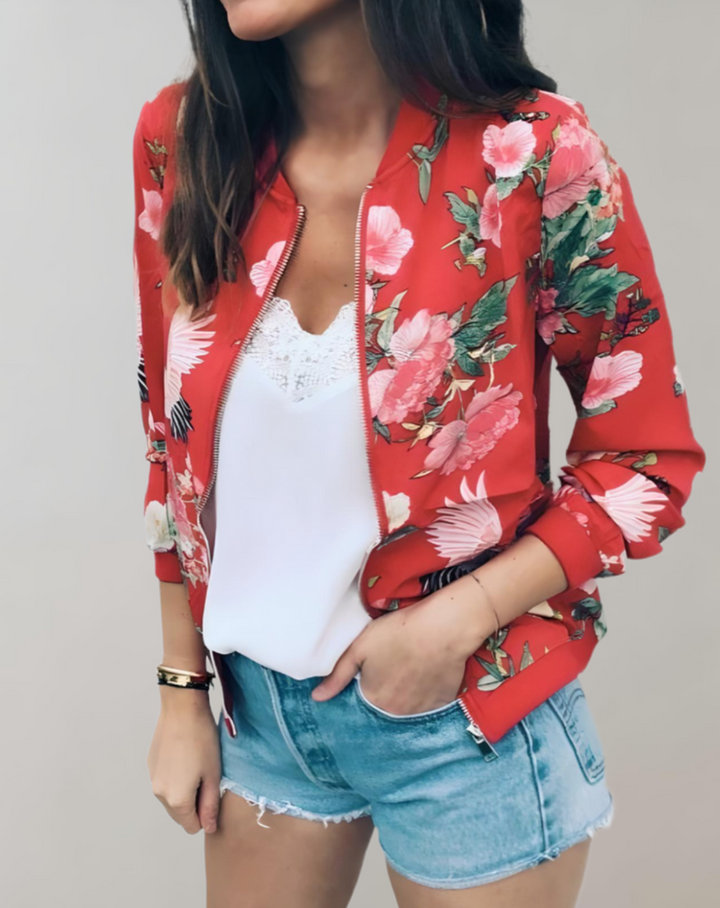 Vibrant floral print bomber jacket for women. Chic and lightweight, ideal spring outerwear for a stylish statement.