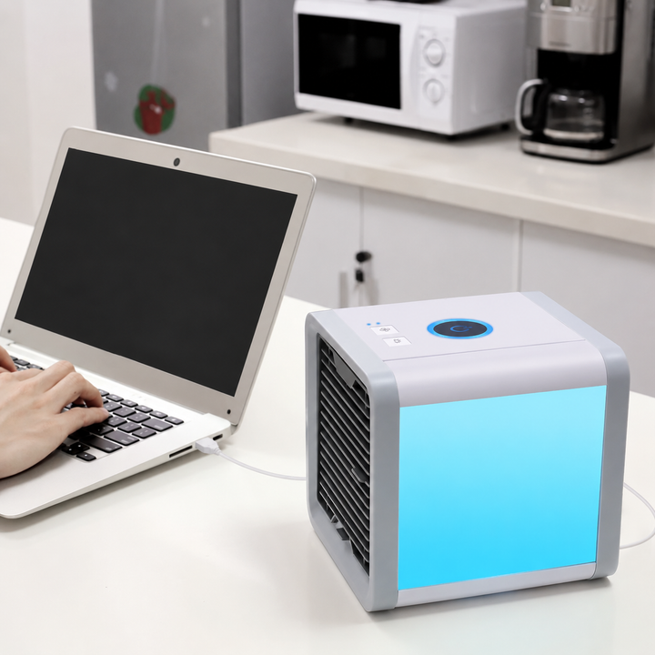 Compact personal air cooler, humidifier, & purifier for bedside or desk, providing cool air.