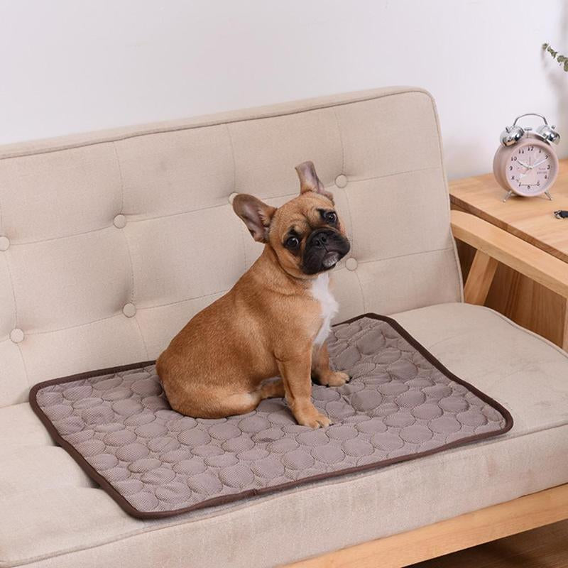 "Pet cooling pad in light blue, ideal for summer. Features breathable, machine-washable fabric, available in multiple sizes."