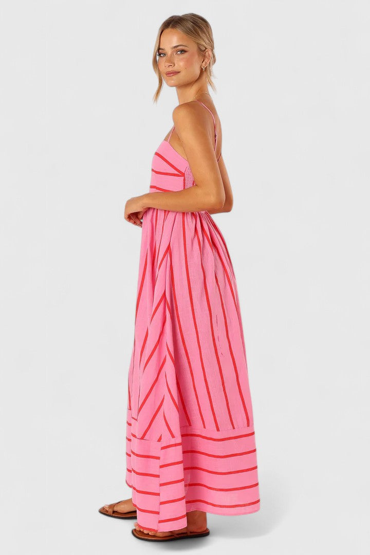 Vibrant pink flowy maxi dress for women, ideal for summer fashion and resort wear.