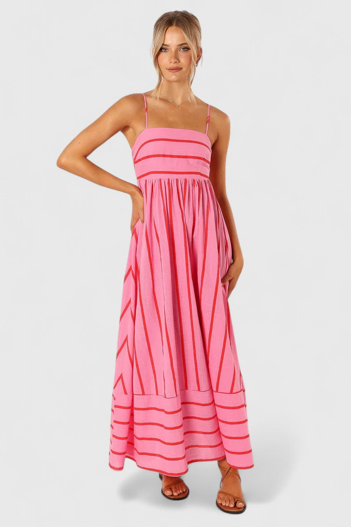 Elegant flowy maxi dress for women, vibrant pink color, versatile for both daytime and evening fashion.