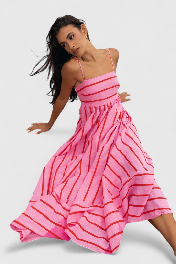 Vibrant pink flowy maxi dress for women, an elegant choice for summer fashion and resort wear.