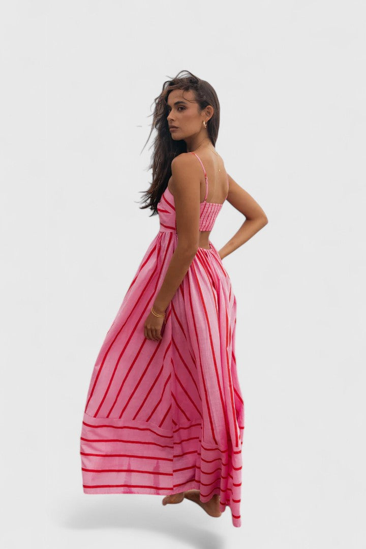 Women's elegant flowy maxi dress in vibrant pink, comfortable & flattering for versatile summer or evening wear.