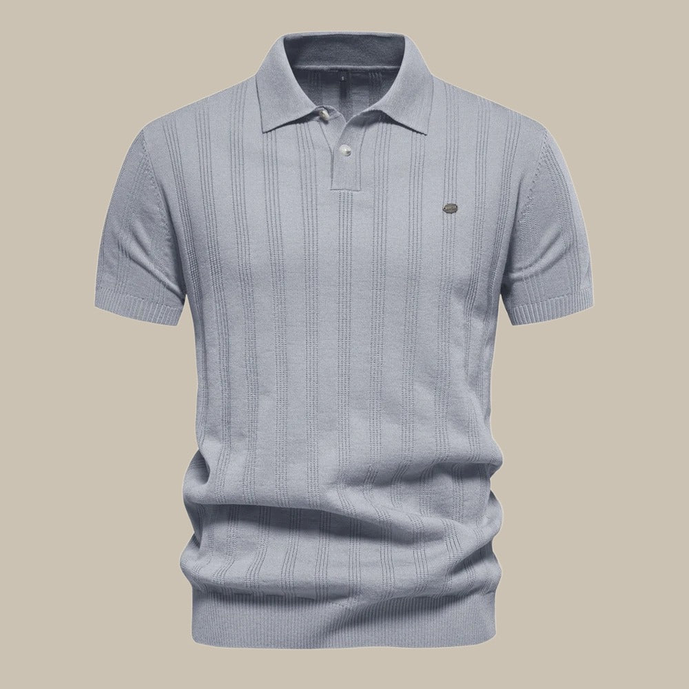 Grey men's knit polo shirt. Breathable short sleeve top for classic smart-casual wear & modern comfort.