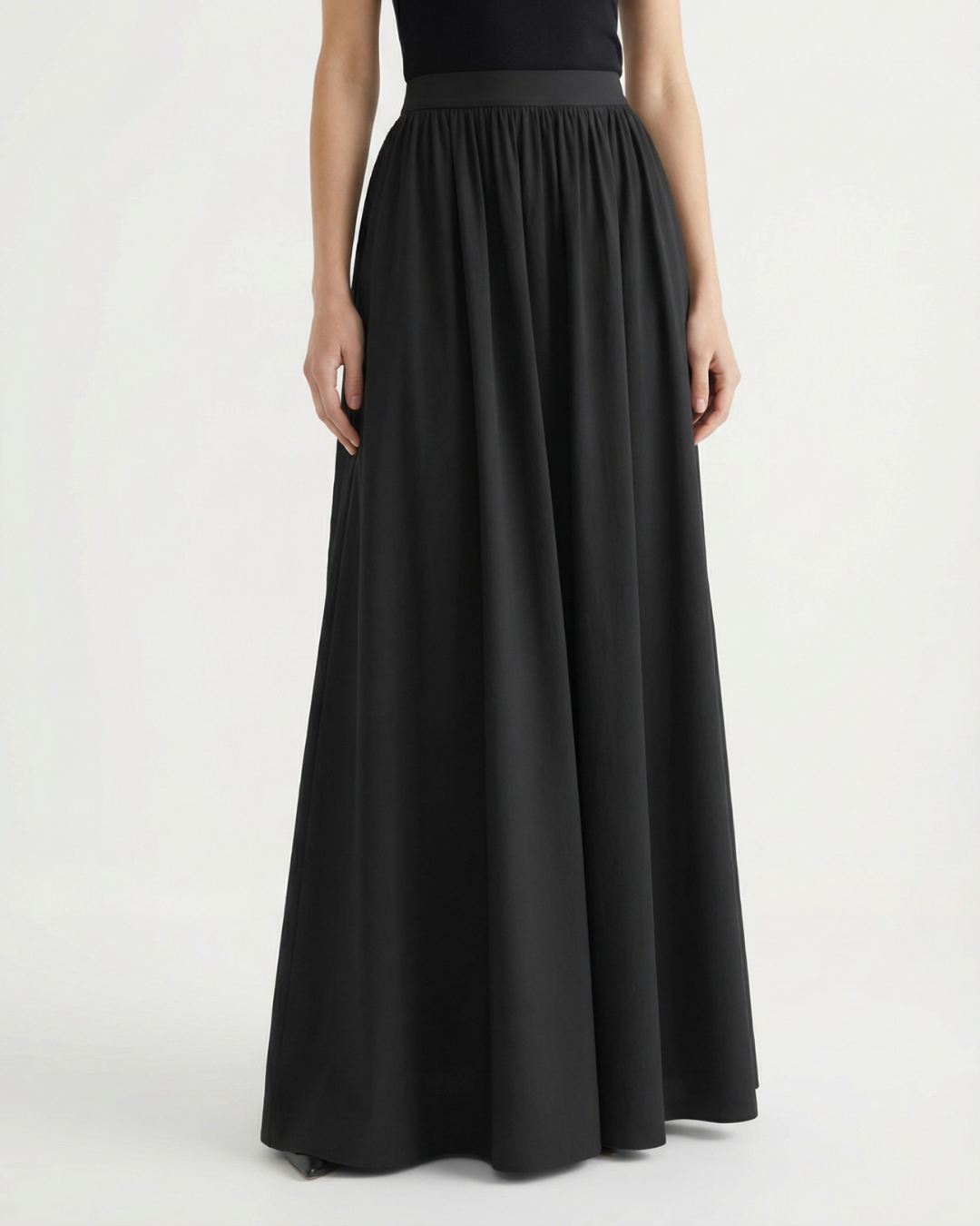 Women's A-line flowing skirt, high-waist design, ideal for an elegant minimalist style.