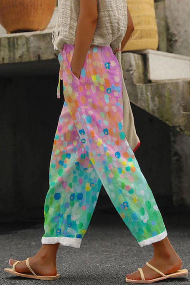 Stylish women's casual pants featuring a unique all-over print, practical pockets, and decorative buttons.