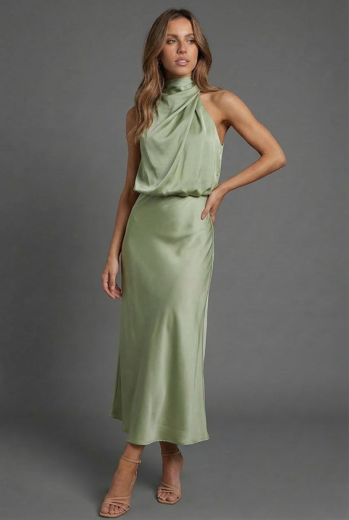 Feminine halter neck summer midi dress, elegant and perfect for a wedding guest.