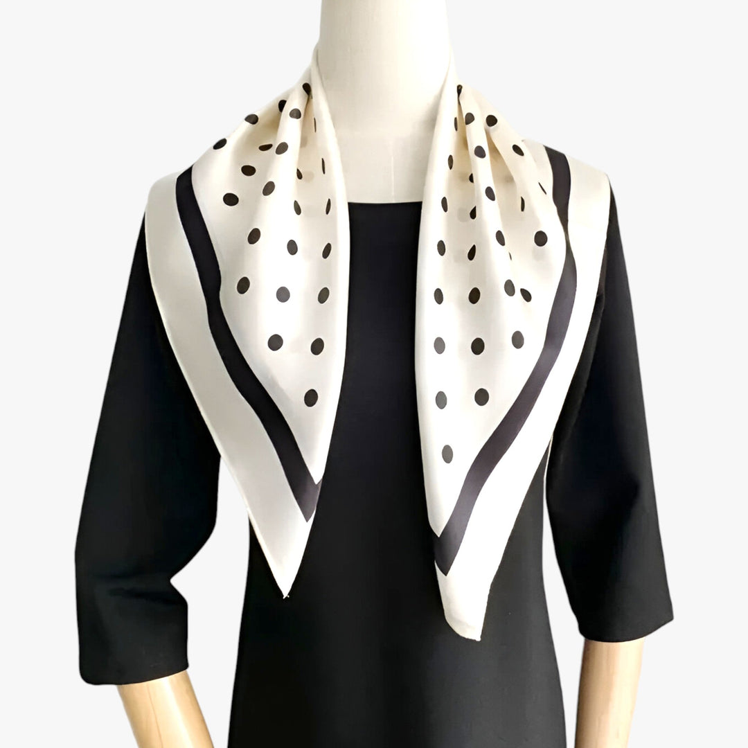Premium women's silk scarf. Elegant printed design, versatile fashion accessory for neck or hair.
