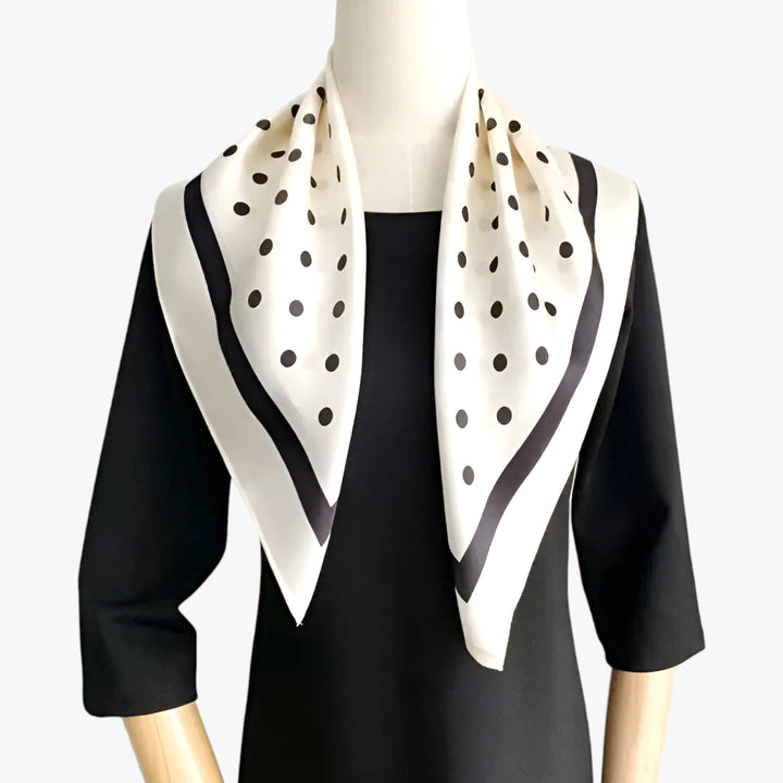 Premium women's silk scarf. Elegant printed design, versatile fashion accessory for neck or hair.
