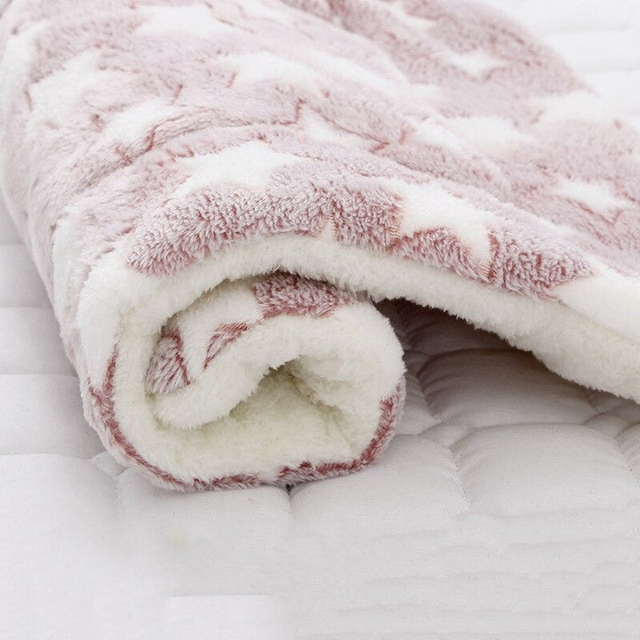Soft plush pet blanket, machine washable, perfect as a calming dog bed or cat bed.