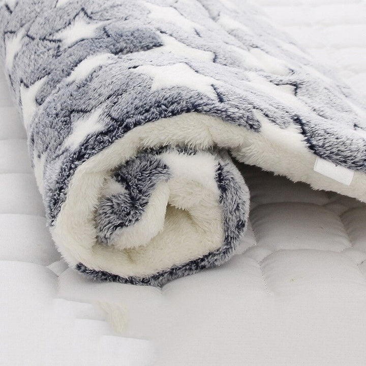 Calming pet blanket offers ultimate comfort & anxiety relief; protects furniture from pet hair.