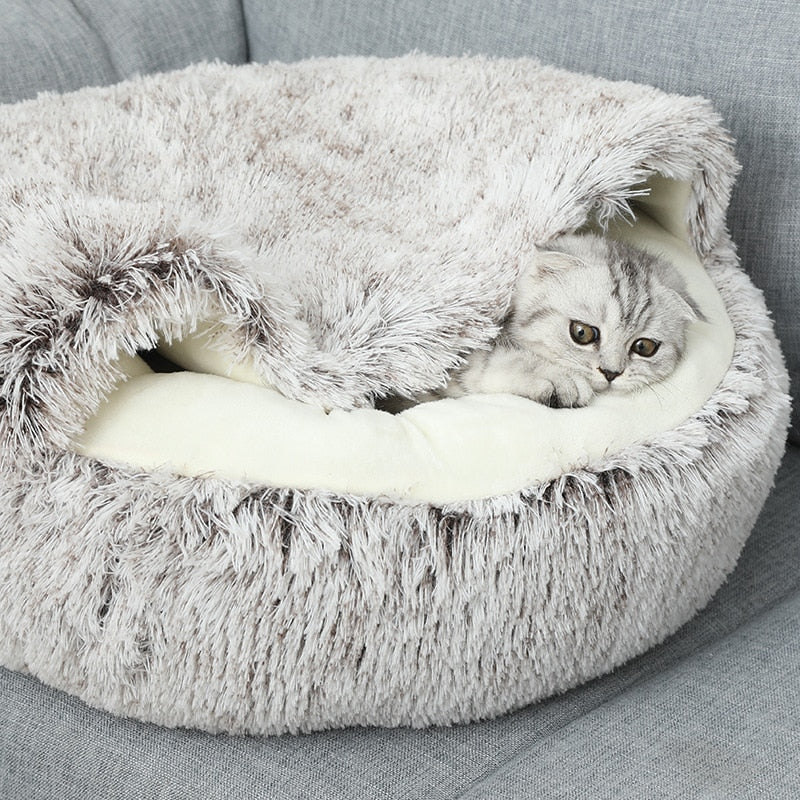 Soft, washable plush pet bed for cats & small dogs. Round snuggle cave offers warmth, comfort, & a calming sanctuary.
