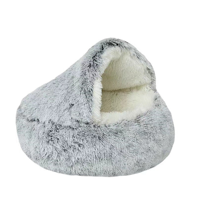 Cozy round pet bed with a cave design for cats & small dogs. Plush, washable fabric ensures ultimate sleep comfort.