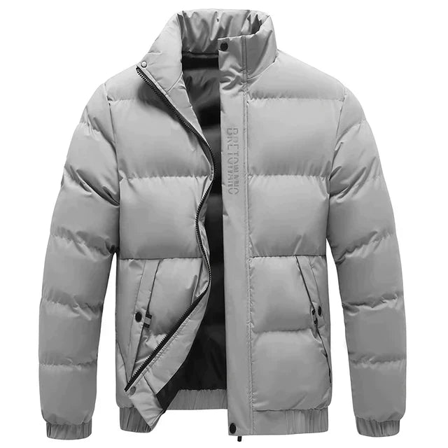 Essential men's quilted puffer jacket, a stylish winter outerwear for cold weather fashion. Zip front.