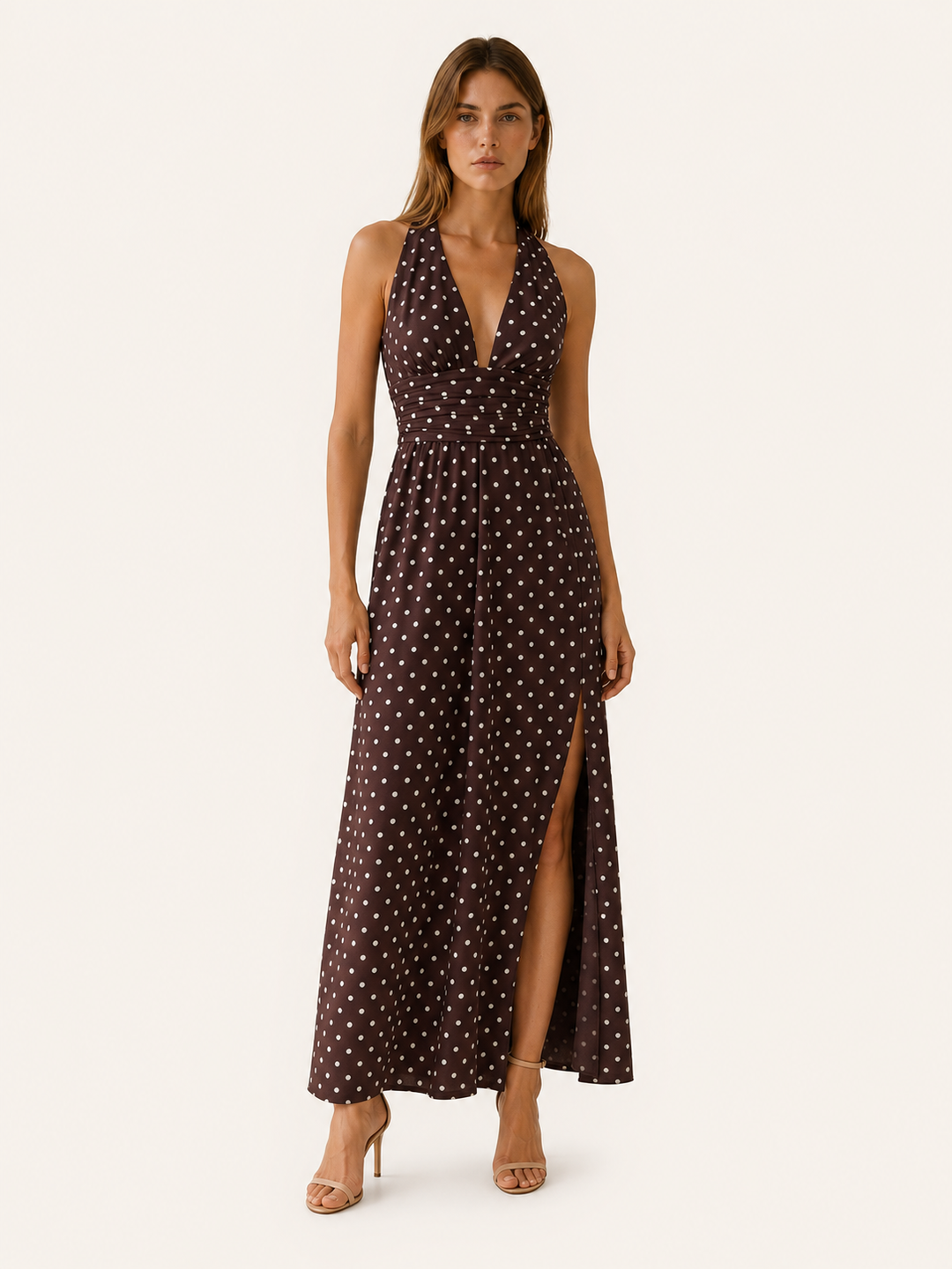 Women's elegant polka dot halter neck maxi dress. Flowy summer style perfect for evening events.