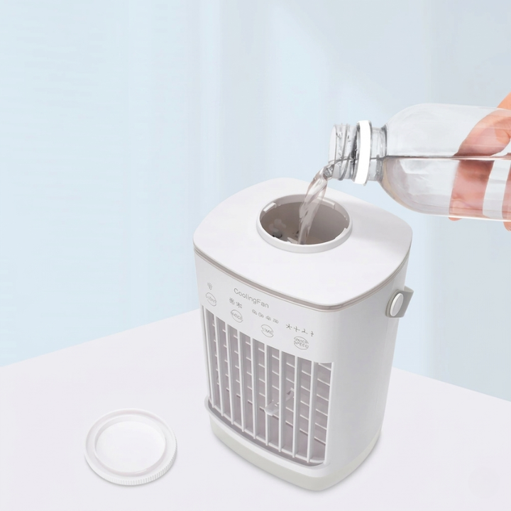 Desk mini air cooler & humidifier with water tank, providing refreshing air misting. USB powered fan.