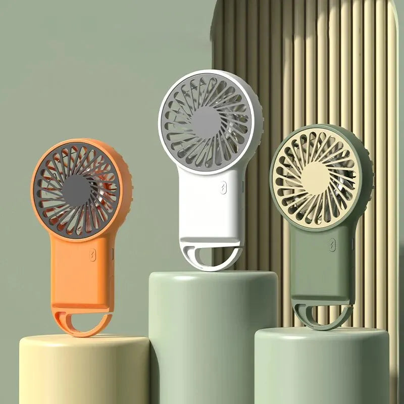 Sleek white portable USB desktop fan for personal cooling in office, home, or travel. Multi-speed function.