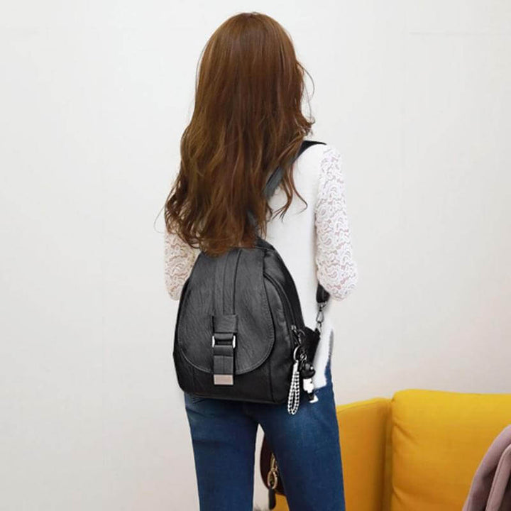 Secure anti-theft design on a women's water-resistant leather travel backpack. Peace of mind for women.