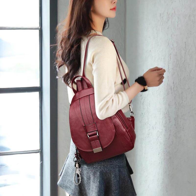 Woman enjoying city walk with her stylish water-resistant leather backpack. A perfect fashion accessory.