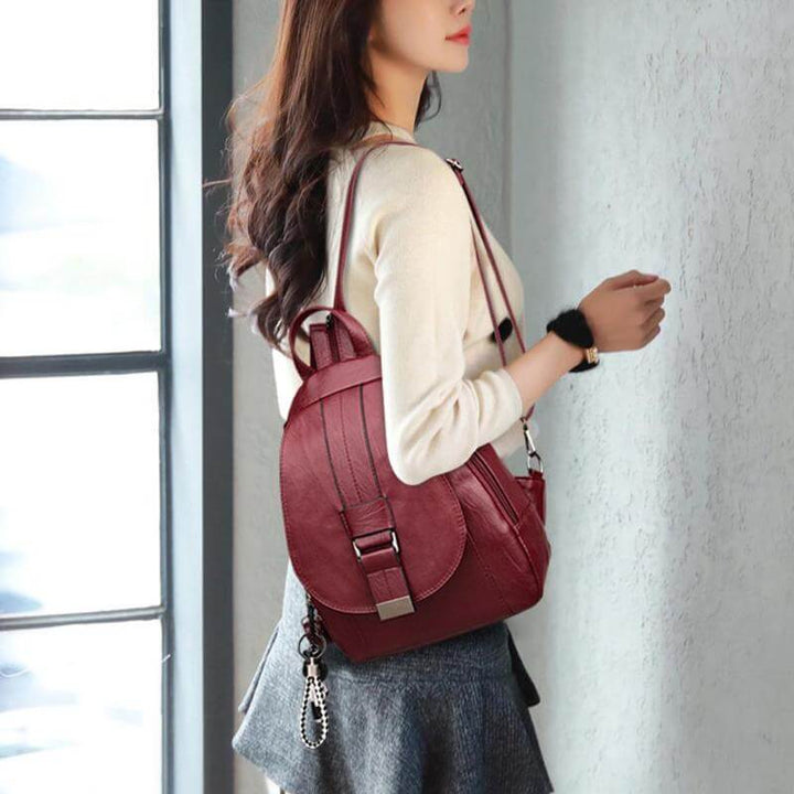 Woman enjoying city walk with her stylish water-resistant leather backpack. A perfect fashion accessory.