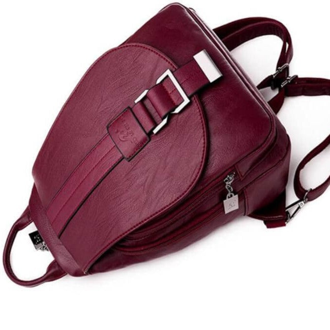 Elegant women's leather backpack for everyday carry. Fashionable water-resistant sheepskin shoulder bag.